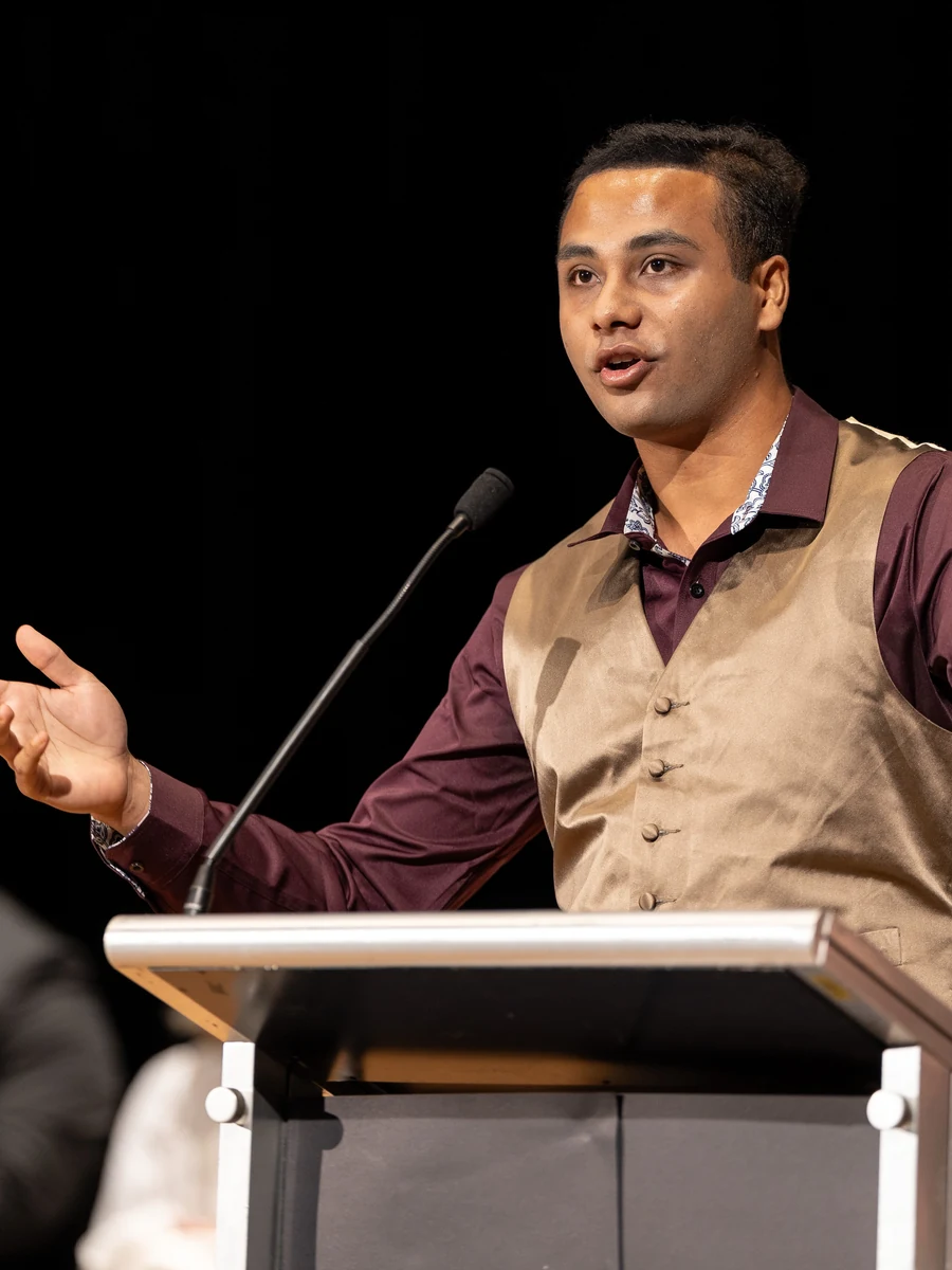 Nehal addressing delegates at a leadership summit