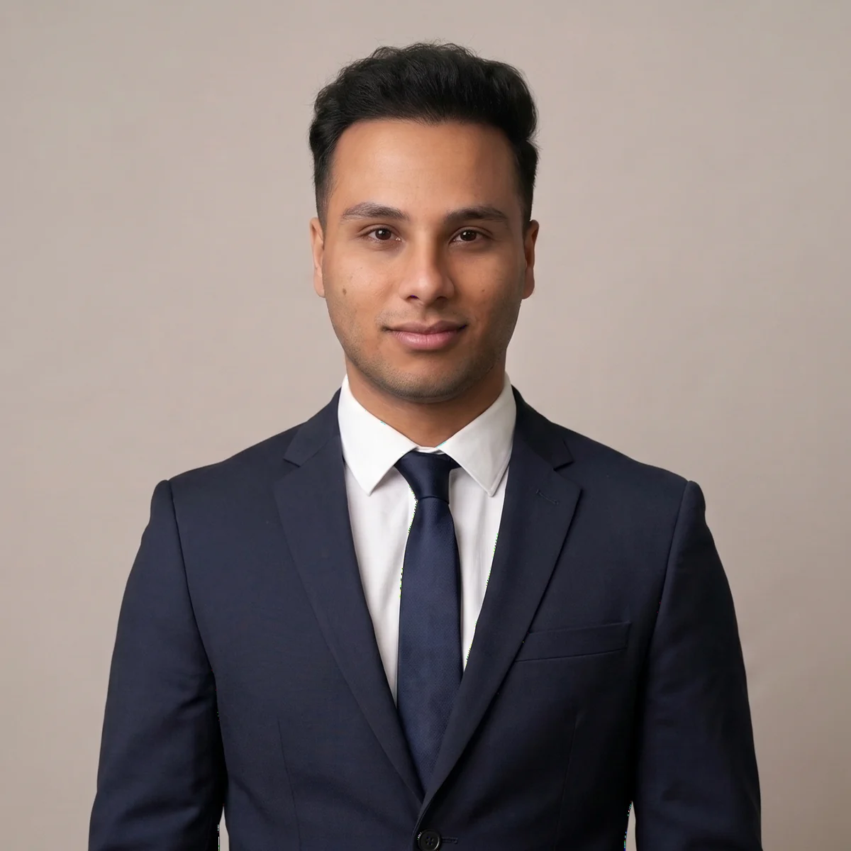 Nehal Nafcy in a navy suit and tie
